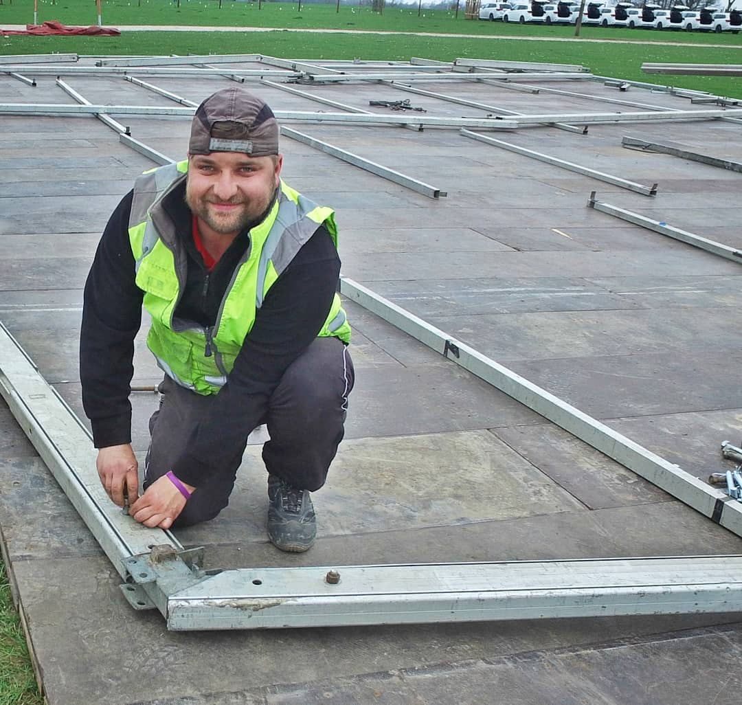Danco employee erecting a marquee. 