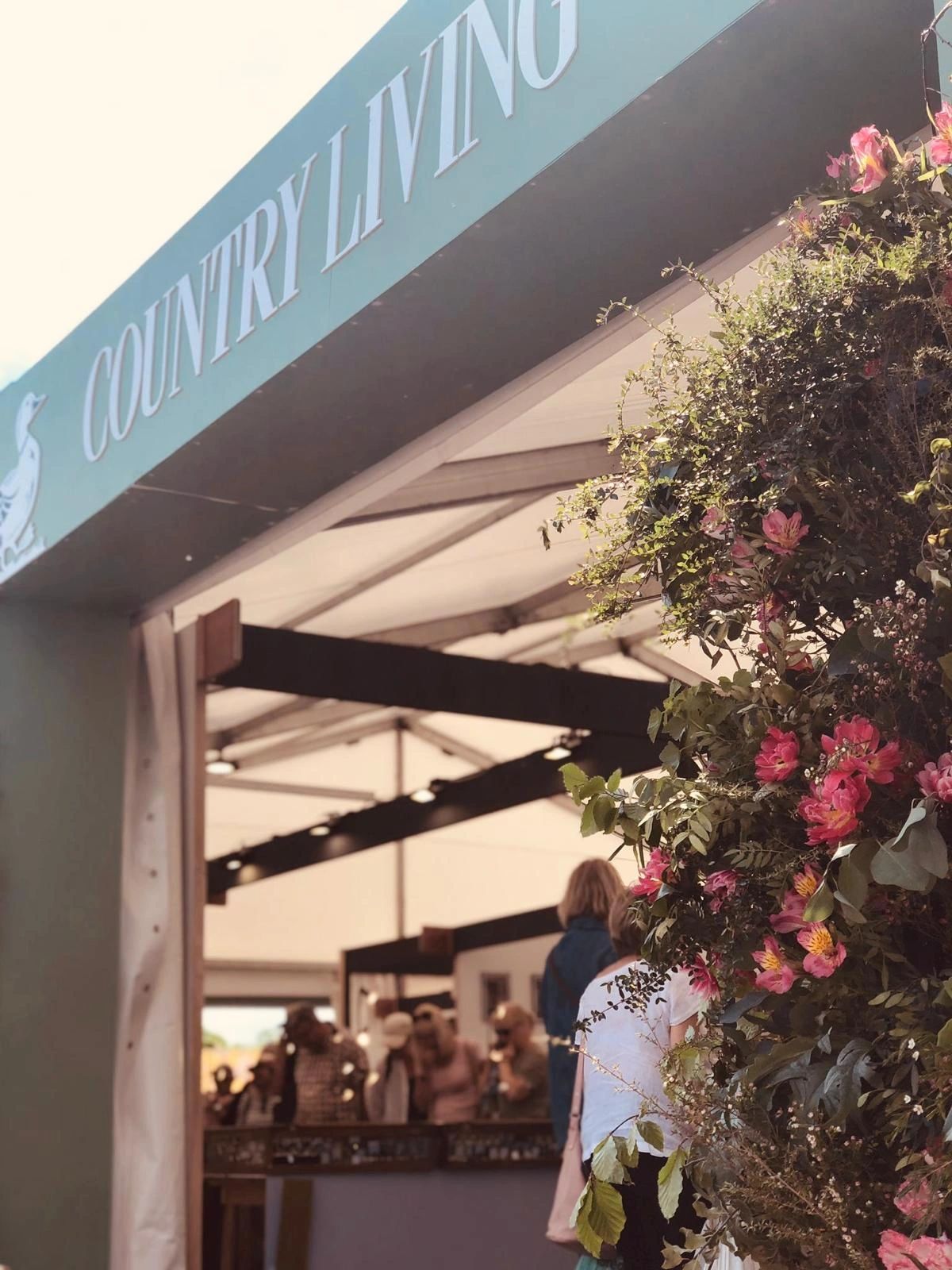 Country Living branding across the top of a marquee at Malvern. 