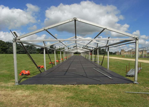 Contour Floor - marquee frame erected with contour floor on a cloudy day. 